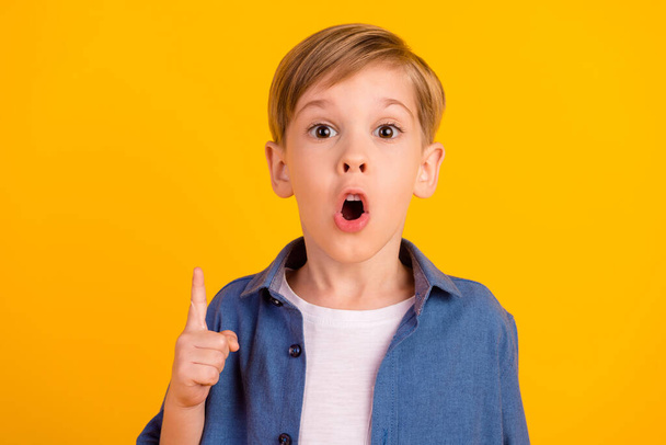 Portrait of excited crazy smart boy point finger open mouth brilliant isolated on yellow color background. - Foto, Imagem