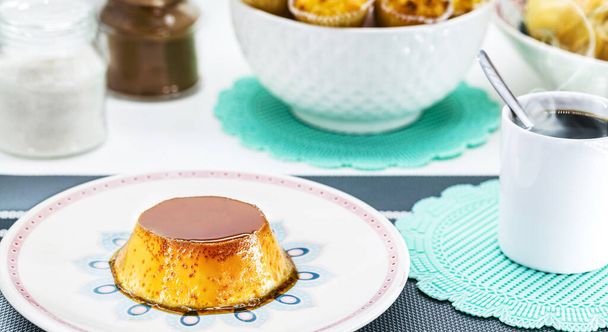 condensed milk pudding with caramel and vanilla cream, typical sweet from Brazil. Homemade dessert served for breakfast - Foto, imagen