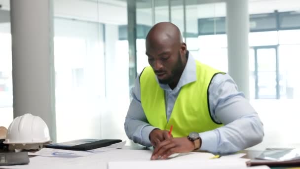 Architect, building planner or construction worker writing and drawing on plans or blueprints. Architecture and planning with a design professional at work on schematics for remodelling or renovation. - Video