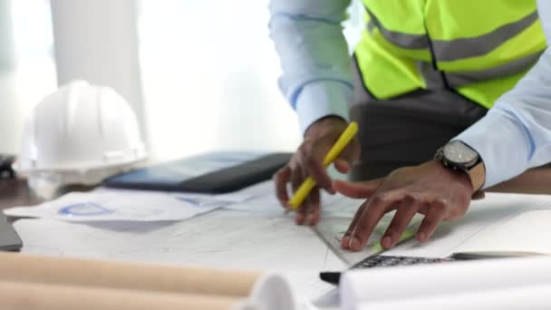 Hands of professional design, architect engineer drawing with graphic tools, construction plans blueprint. Closeup of an industrial designer working on illustration for new modern building project. - Filmagem, Vídeo