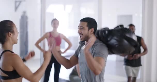 Motivation, fun and support in fitness class or center by friends cheering during physical challenge. Excited, fun group exercising together, celebrating body goals, and benefits of healthy lifestyle. - Záběry, video