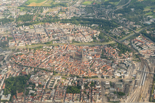 Ulm, Germany, July 9, 2022 City and the historic Church seen from a small plane - Foto, afbeelding