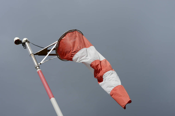 Windsock close up on gray sky background - Foto, immagini
