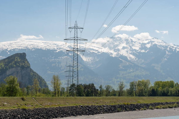 Balzers, Liechtenstein, April 28, 2022 High voltage electric pole in an alpine scenery - Valokuva, kuva