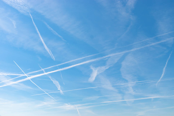 Switzerland, May 11, 2022 Contrails formation on a sunny day in spring time - Valokuva, kuva