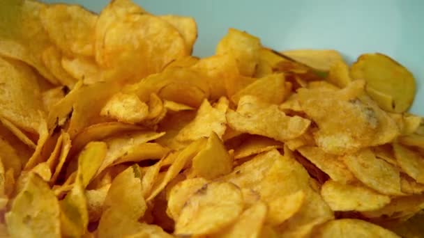 Potato chips close-up, hand takes snacks. Eating fast food. High quality 4k footage - Filmagem, Vídeo