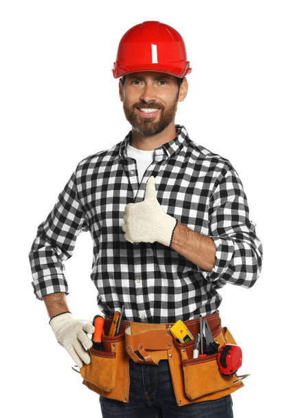 Professional builder in hard hat with tool belt isolated on white - Photo, Image