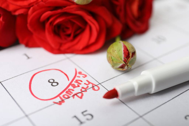 Roses and red marker on calendar near date 8th of March, closeup. International Women's Day - Photo, Image