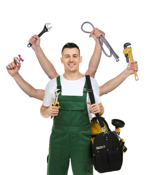 Plumber with different tools on white background. Multitasking handyman - Foto, Imagen