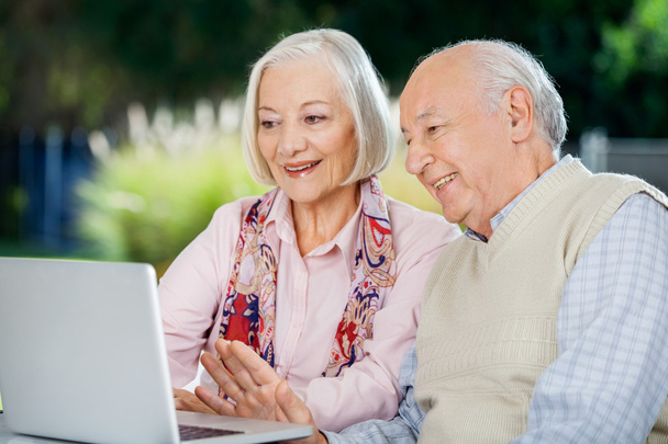 Senior Couple Video Chatting On Laptop - Valokuva, kuva