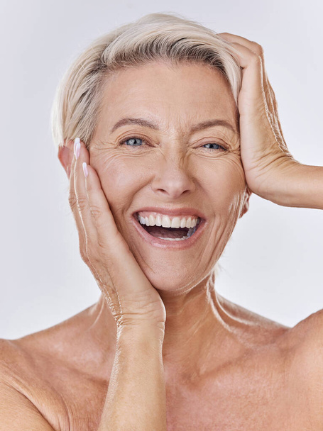 Skincare, wrinkles and face of old woman or model in beauty, cosmetics or flawless skin portrait isolated on studio background. Big smile senior lady posing with anti aging skin care wellness routine. - Фото, зображення