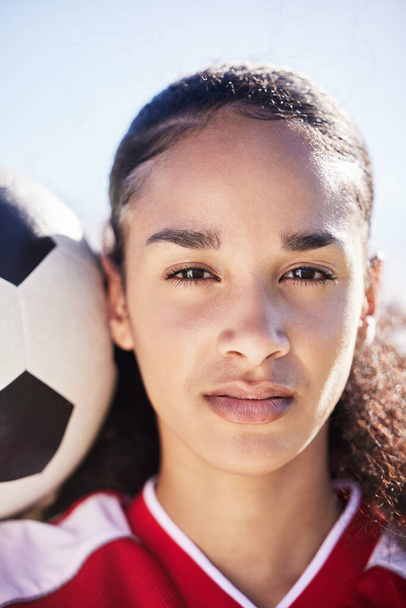 Serious, female and young soccer athlete with a football ready for a workout, match or exercise. Portrait of a teen student girl face in a sport uniform before fitness and school sports training. - Zdjęcie, obraz
