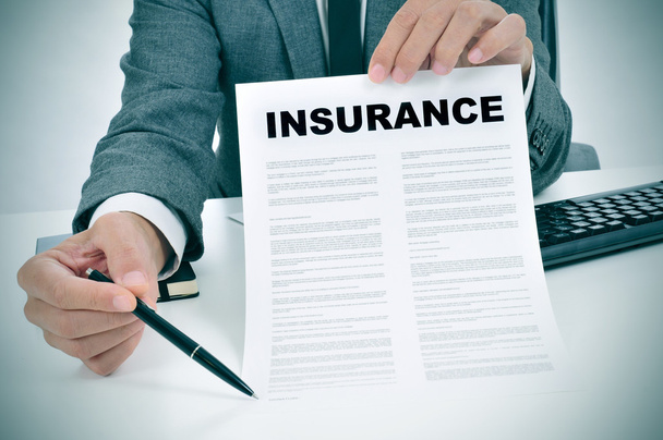 young man in suit showing an insurance policy - Photo, Image