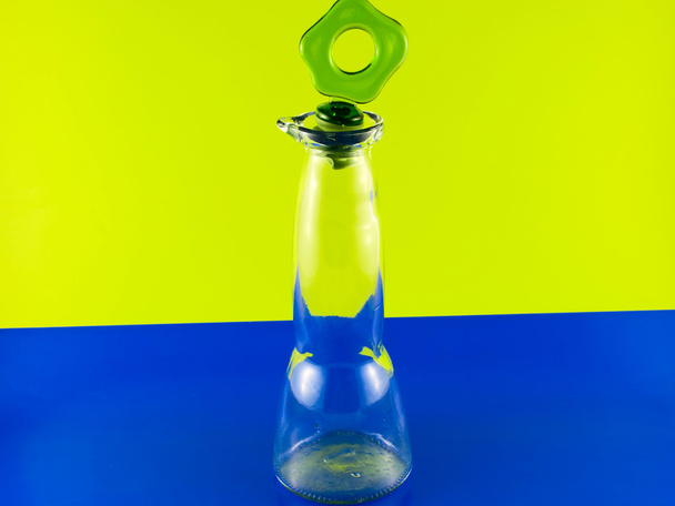 Glass bottle on a colorful background - Foto, Imagem
