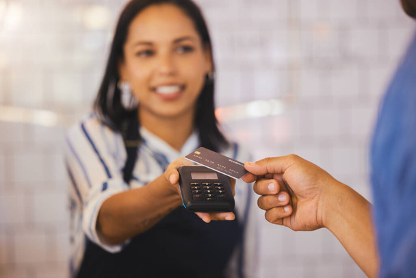 Credit card, payment and customer with an electronic reader in the hand of a cashier to process a fintech purchase or money spend. Consumer making a banking or finance transaction in a coffee shop. - Photo, Image