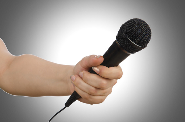Hand with microphone on white - Fotó, kép