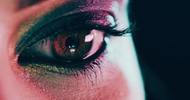 Eye, makeup and art of a creative woman in close up and zoom of artistic eyeshadow or cosmetic creativity. A stylish, fashionable and trendy model with a colorful shadow or fashion. - Video