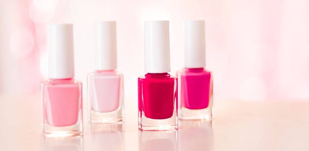 Shades of pink and red nail polish set on glamour background, nailpolish bottles for manicure and pedicure, luxury beauty cosmetics and make-up brand ad - Valokuva, kuva