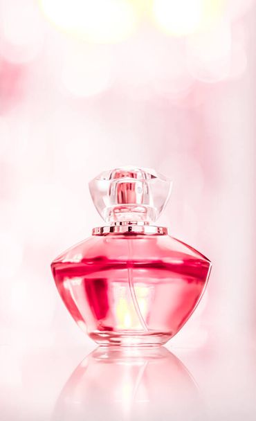 Perfume bottle on glamour background, floral feminine scent, fragrance and eau de parfum as luxury holiday gift, cosmetic and beauty brand present concept - Photo, Image