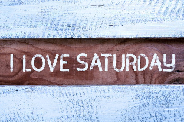 Conceptual display I Love Saturday, Business idea To have affection for the weekend happy excited relax Important Informations Written On Piece Of Wood On Floor. - Photo, image