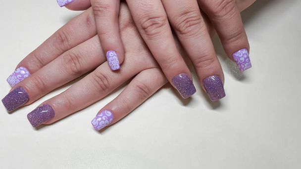 Acrylic nail extension, manicure, nail correction, hands in the foreground. copy space - Foto, immagini