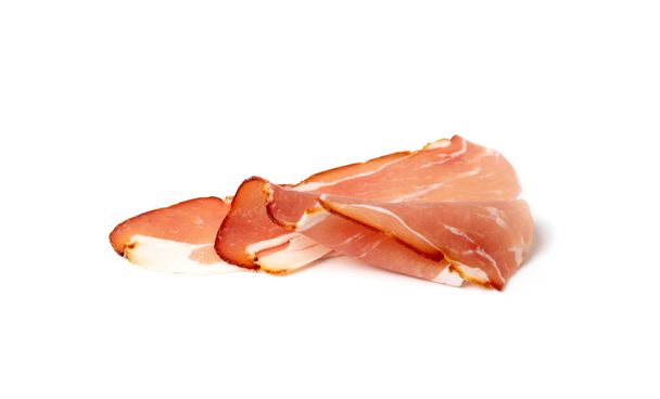 Prosciutto isolated. Spanish jamon slices, parma ham, sliced serrano, iberico, spanish ham, cured meat snack on white background - Photo, Image