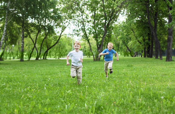 Portrait of two boys in the summer outdoors - Фото, зображення