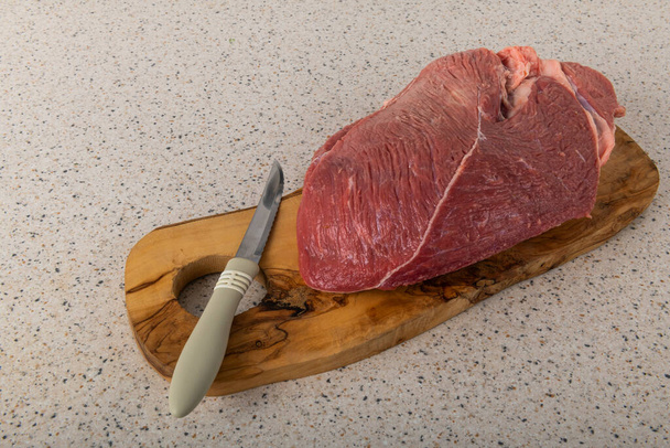 Fresh piece of veal meat on a cutting board - Photo, Image