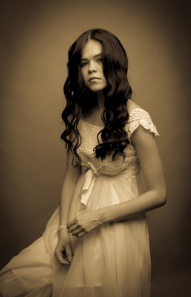Girl with black hair in a light dress - Fotoğraf, Görsel