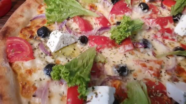 Pizza with bacon and cheese, herbs and cherry tomatoes. With mozzarella, shrimp and octopus, mussels and other products on a wooden background. fast food - 映像、動画