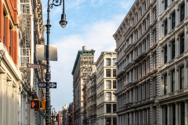 Old buildings at the intersection of Broome and Wooster Streets in the SoHo neighborhood of New York City NYC - 写真・画像