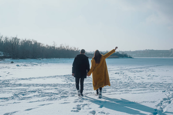 happy couple walking on ice - 写真・画像
