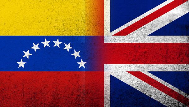 National flag of United Kingdom (Great Britain) Union Jack with The Bolivarian Republic of Venezuela National flag. Grunge background - Foto, afbeelding