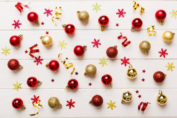 Christmas composition. a pattern of christmas balls on colored background. Flat lay, top view New year decor. - Photo, image