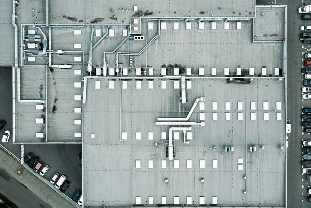 Aerial view of the roof of the factory, ventilation on the roof of the building - Zdjęcie, obraz