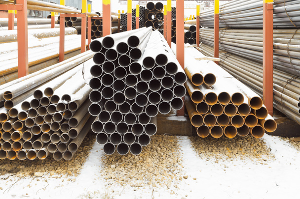 piles of steel pipes in outdoor warehouse - Photo, Image