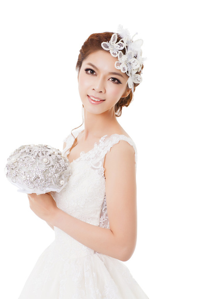Young  beautiful bride with flowers - Photo, image