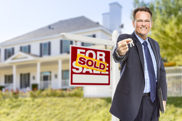 Agent with Keys in Front of Sold Sign and House - Photo, Image