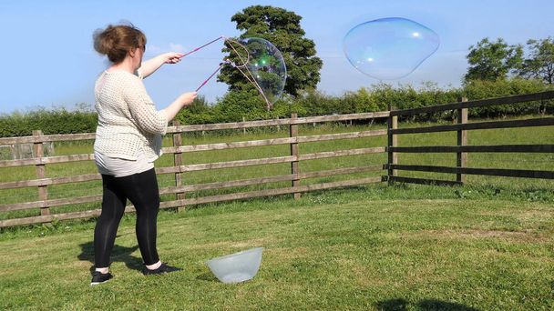 Giant Soap Bubble with a Bubble wand - Φωτογραφία, εικόνα
