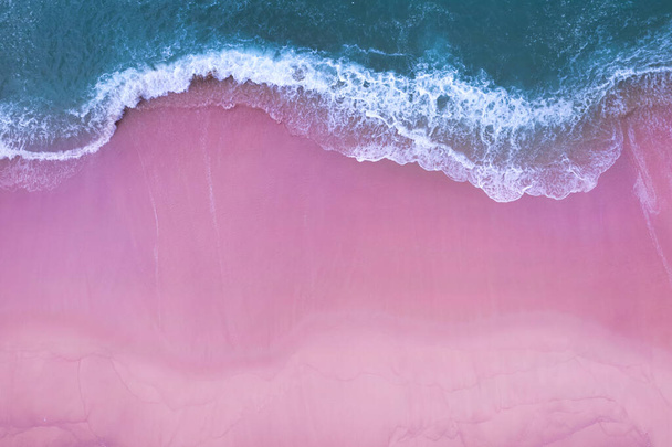 Beach Sand Sea Shore and waves white foamy summer sunny day background.Amazing pink beach top down view overhead seaside nature background - Fotoğraf, Görsel