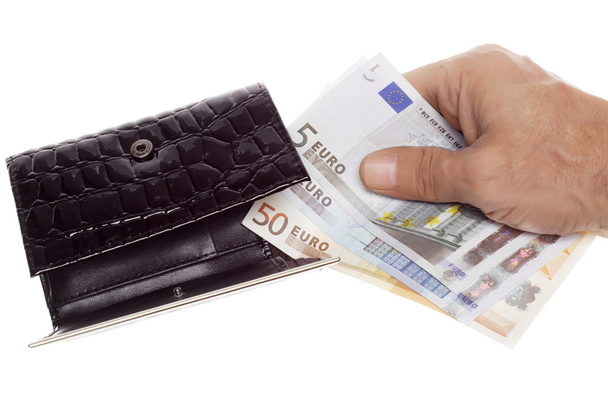 Рука держит евро в бумажнике
 - Фото, изображение