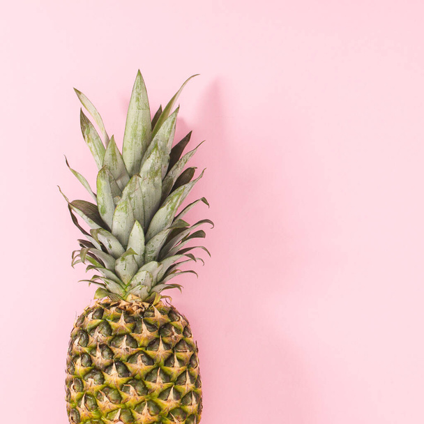 Fresh pineapple on on bright pink background. Flat lay - Фото, изображение