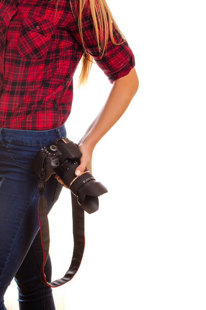 Female photographer holding a professional camera - isolated on  - Fotó, kép