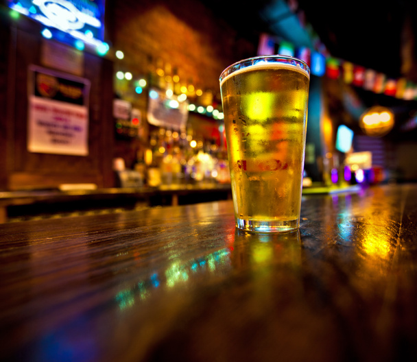 Pint of beer on a bar - Photo, Image