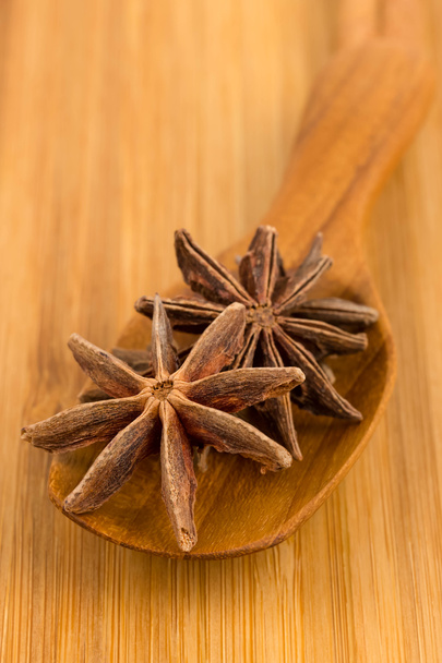 Anise stars in wooden spoon - Photo, Image