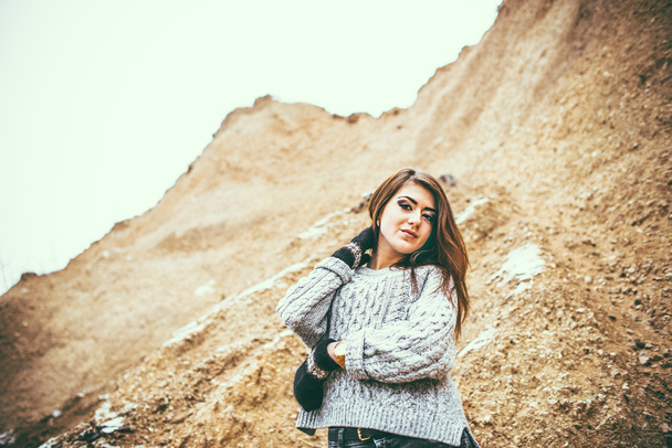 Pretty young woman outdoor in quarry with sand - 写真・画像