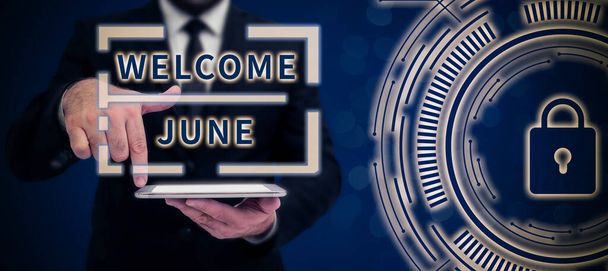 Conceptual caption Welcome June, Word for Calendar Sixth Month Second Quarter Thirty days Greetings Businessman in suit holding notepad symbolizing successful teamwork. - Foto, Imagem