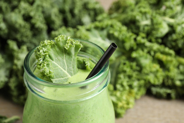 Tasty fresh kale smoothie on table, closeup - Photo, image