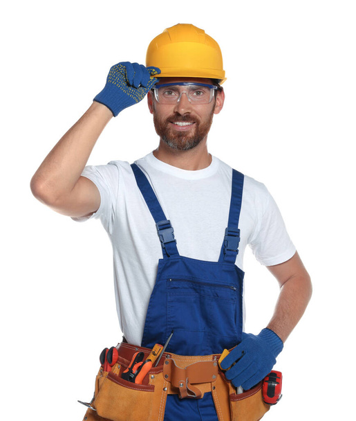 Professional builder in uniform with tool belt isolated on white - Fotografie, Obrázek