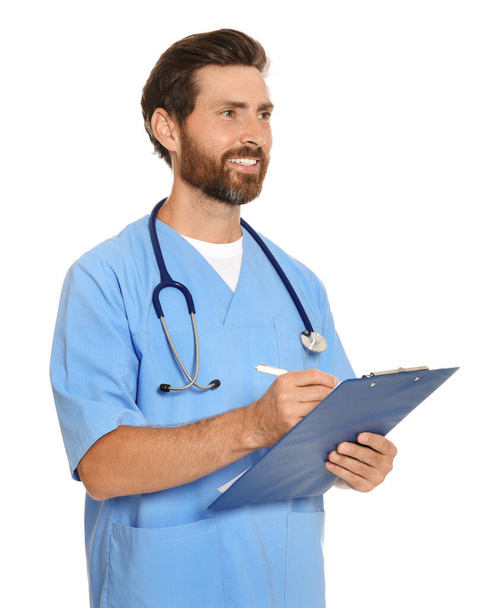 Happy doctor with stethoscope and clipboard on white background - Foto, imagen